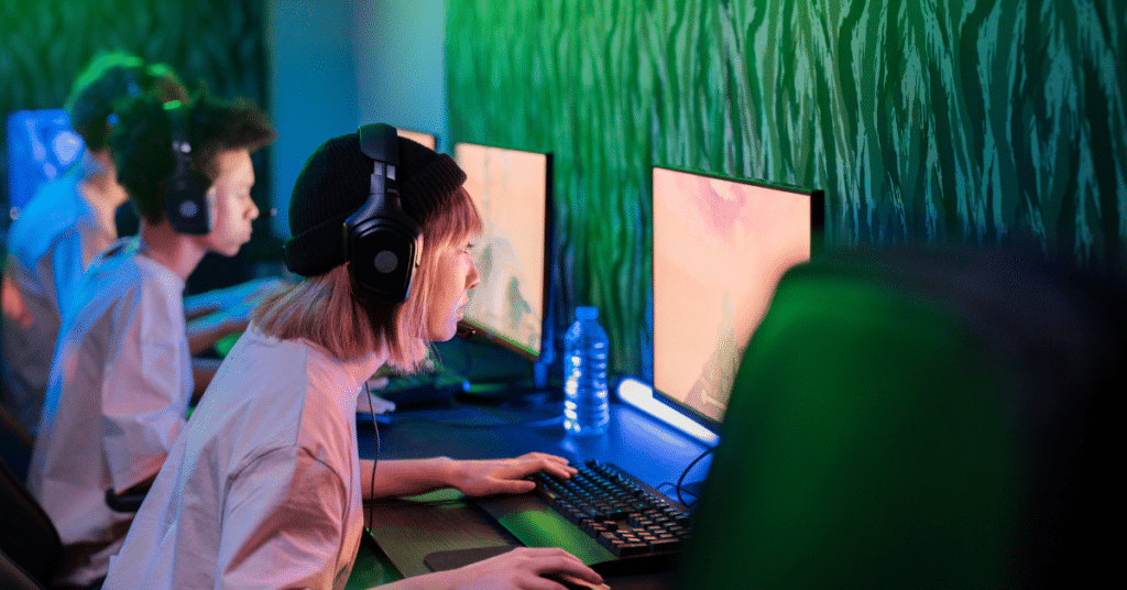 Group of young people looking at computer screens