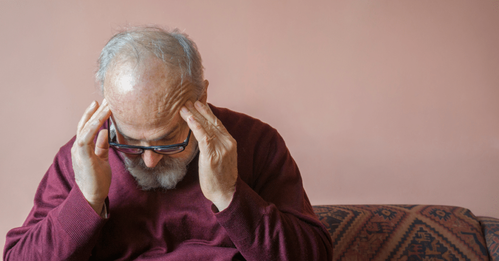 Man experiencing a migraine headache