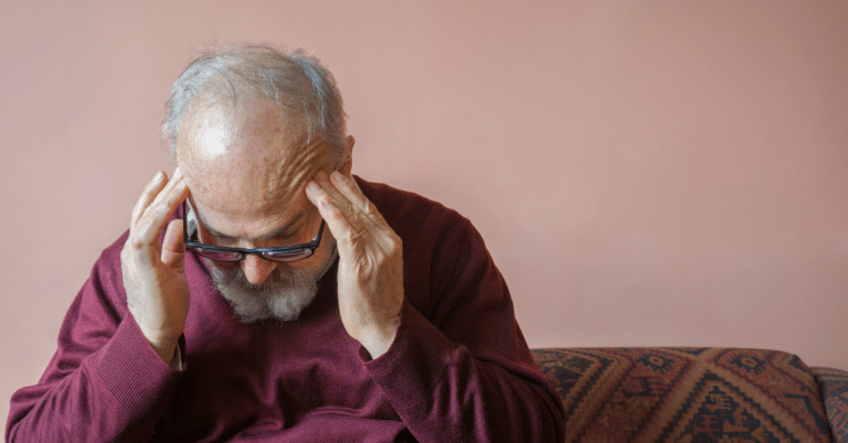 Man experiencing a migraine headache