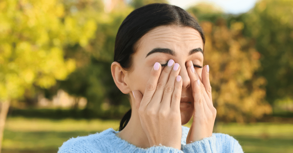 Woman experiencing eye allergies