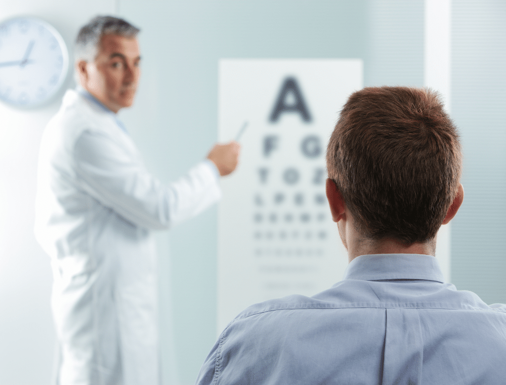 Man having his eyes examined by a doctor